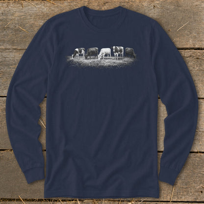 Five cows grazing in a field depicted on a navy blue long-sleeved shirt.