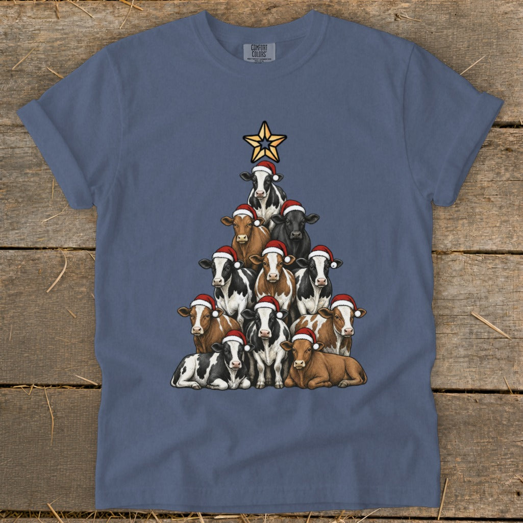 T-shirt with cows arranged in a Christmas tree shape, wearing Santa hats.