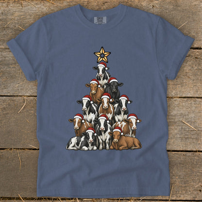 T-shirt with cows arranged in a Christmas tree shape, wearing Santa hats.