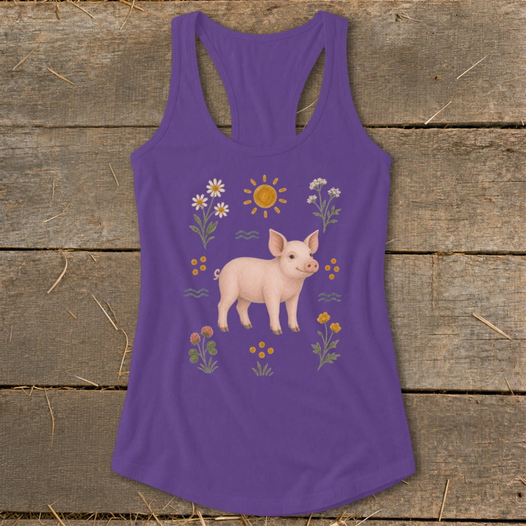 Purple tank top with a graphic of a pig surrounded by flowers and a sun.