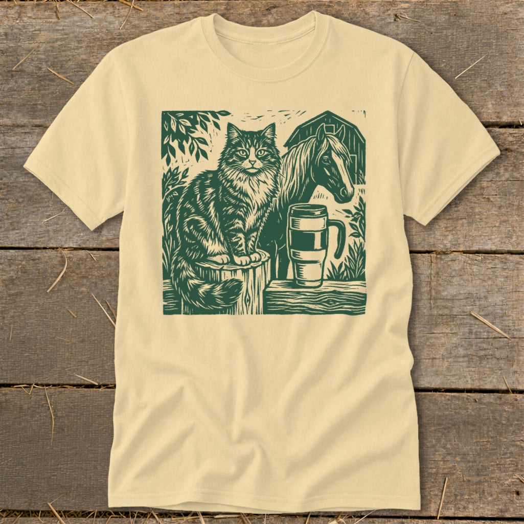 Cat sitting on a post with horse and mug next to a barn.