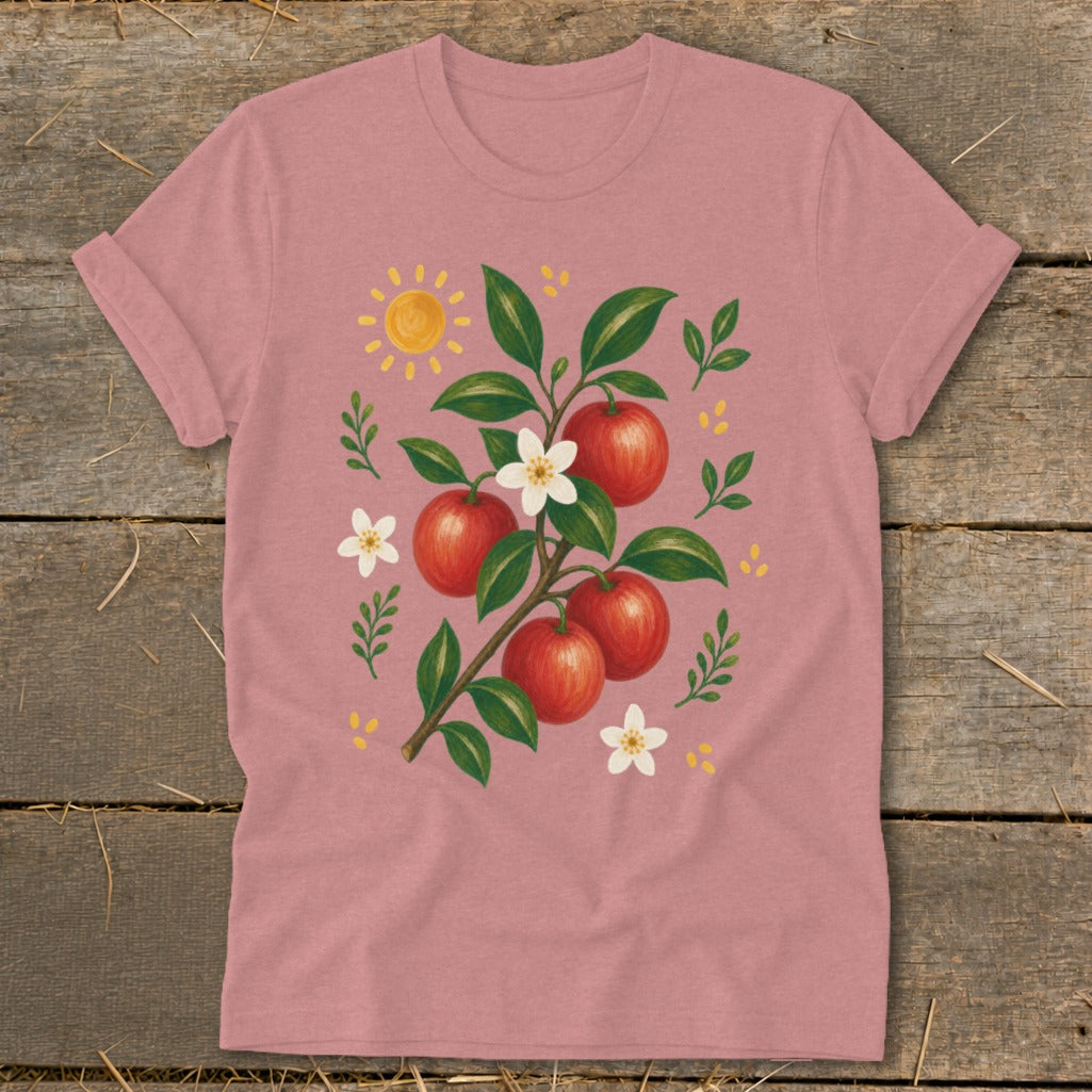T-shirt with a painted branch of red apples, white blossoms, and a sun.