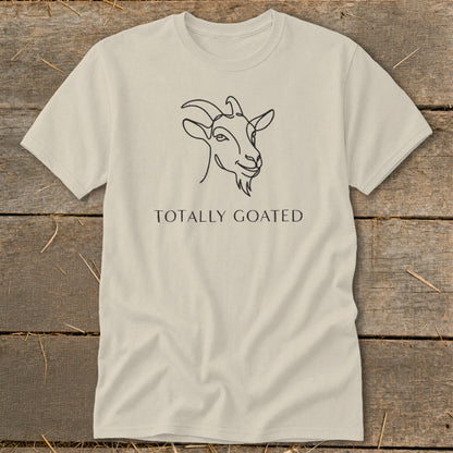 Light tan t-shirt with black line drawing of a goat's head and text "TOTALLY GOATED".
