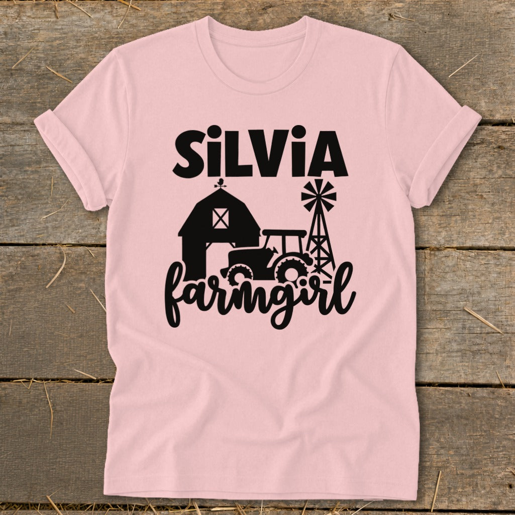 Pink t-shirt with "Silvia farmgirl" text, barn, tractor, and windmill graphics.