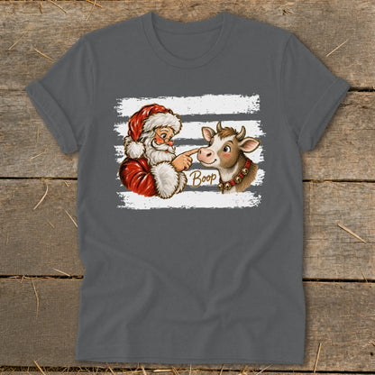 Santa boops a cow's nose with the word "Boop" written in gold text.