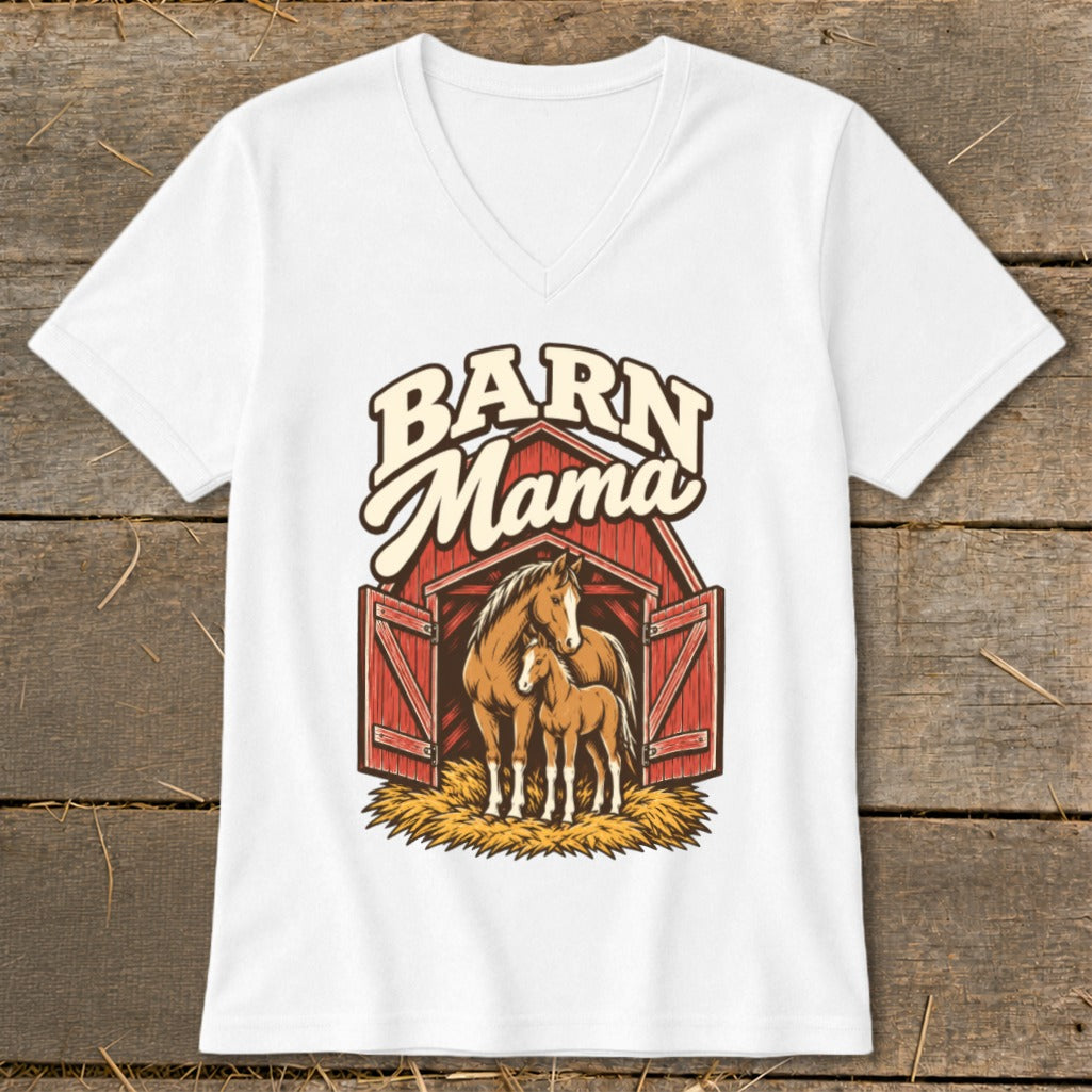 White V-neck t-shirt featuring a graphic of a mare and foal standing in front of a red barn with the text Barn Mama above them.