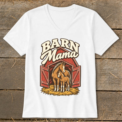 White V-neck t-shirt featuring a graphic of a mare and foal standing in front of a red barn with the text Barn Mama above them.