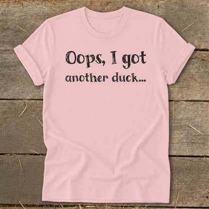 Pink t-shirt with black text that reads "Oops, I got another duck..."