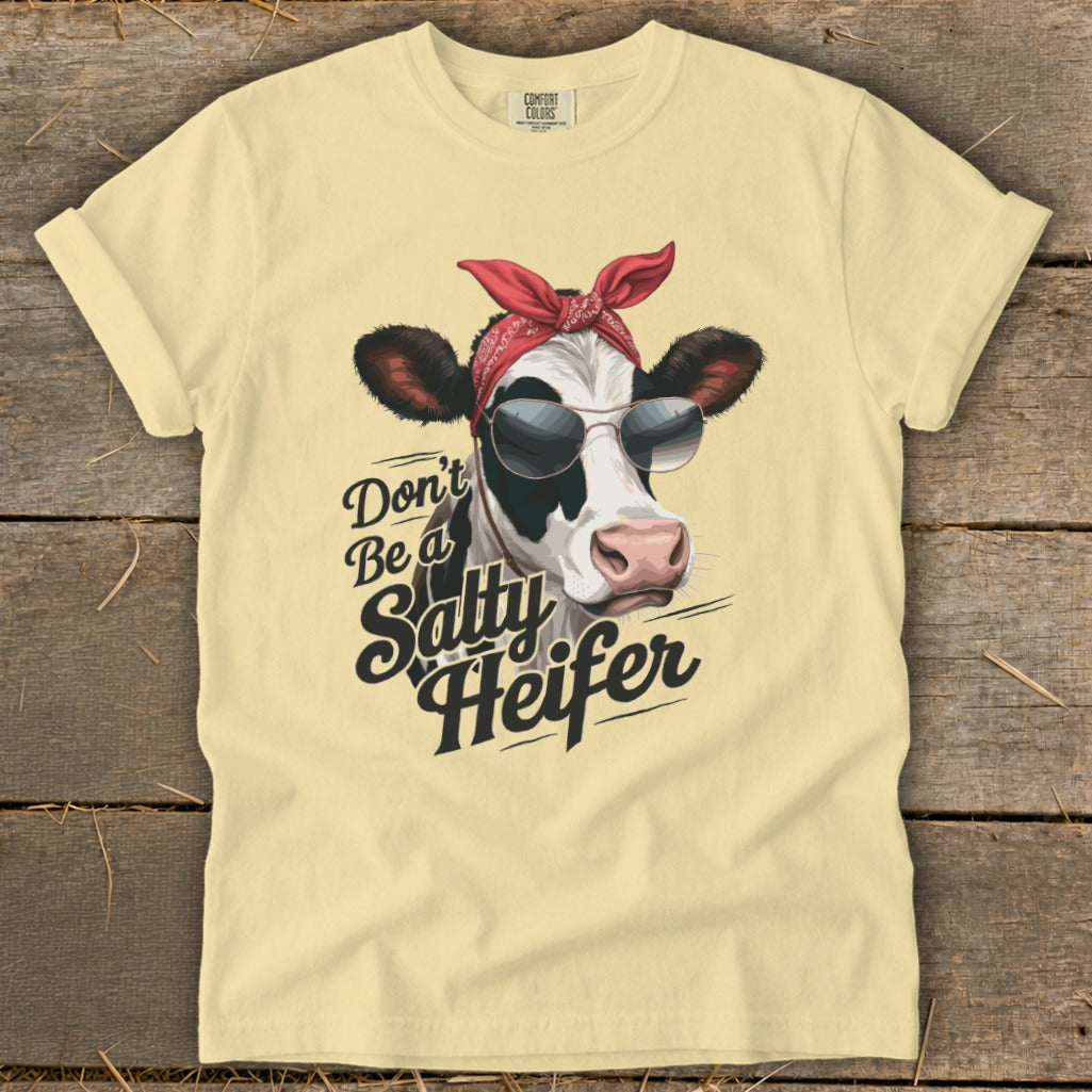 Cow wearing sunglasses and bandana with "Don't Be a Salty Heifer" text.