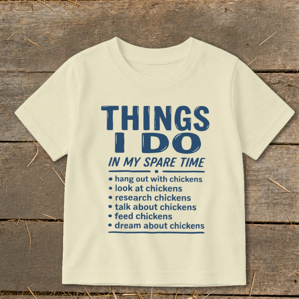 Light yellow t-shirt with blue text listing "Things I Do In My Spare Time".