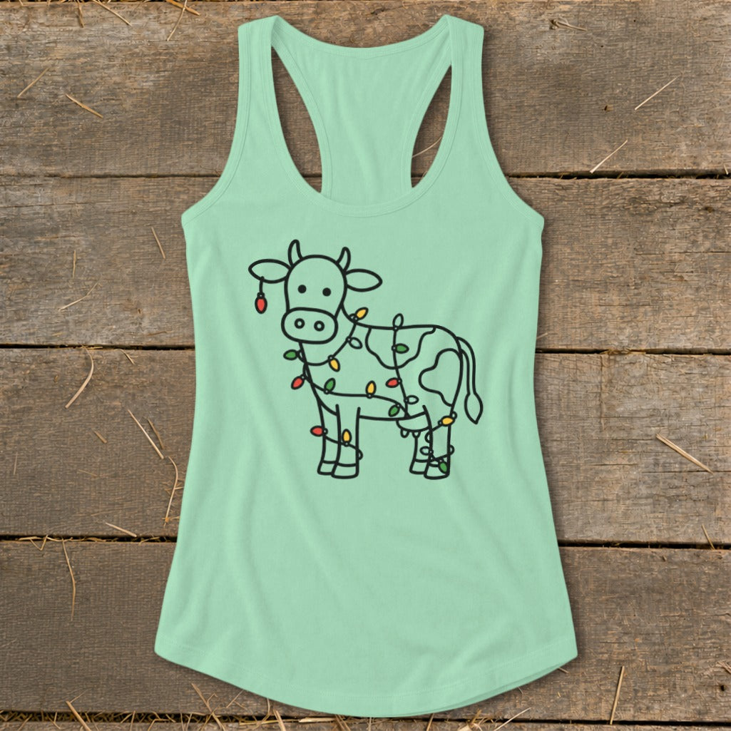 Mint green tank top with a cartoon cow wrapped in colorful Christmas lights.