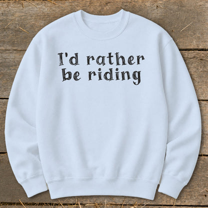 Light blue sweatshirt with "I'd rather be riding" printed in black text.
