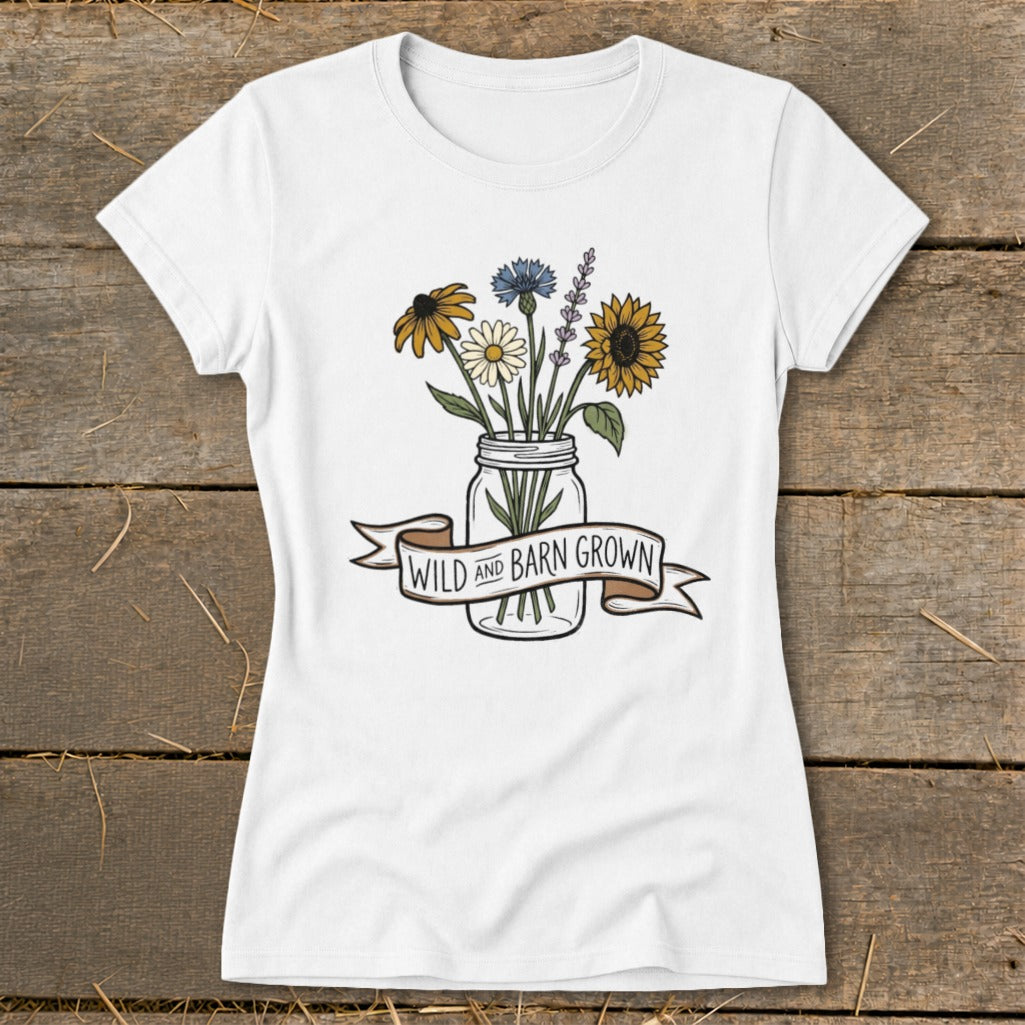 White t-shirt with a mason jar of wildflowers and banner reading "WILD AND BARN GROWN."