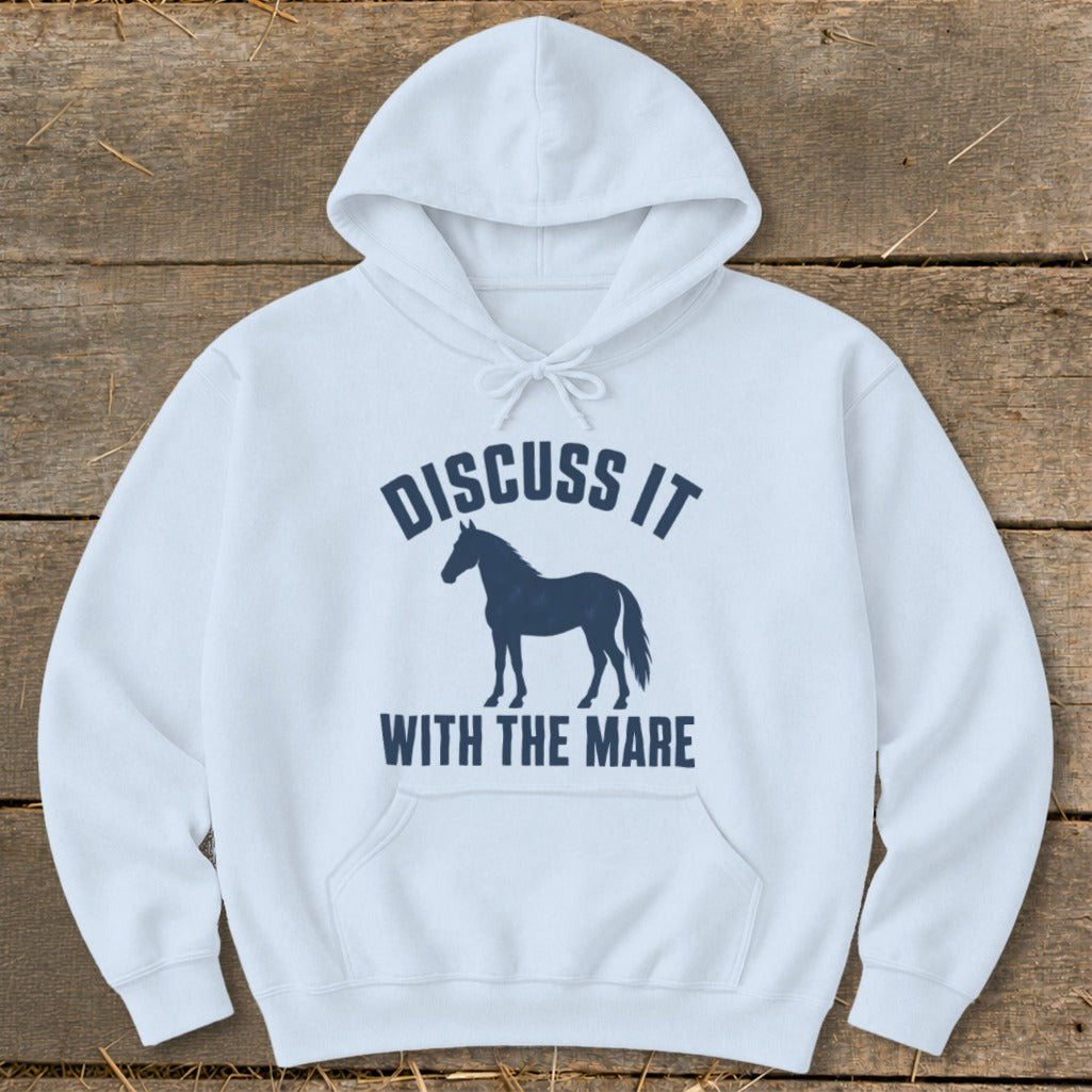 White hoodie with a dark blue graphic of a horse and text saying "Discuss it with the mare".