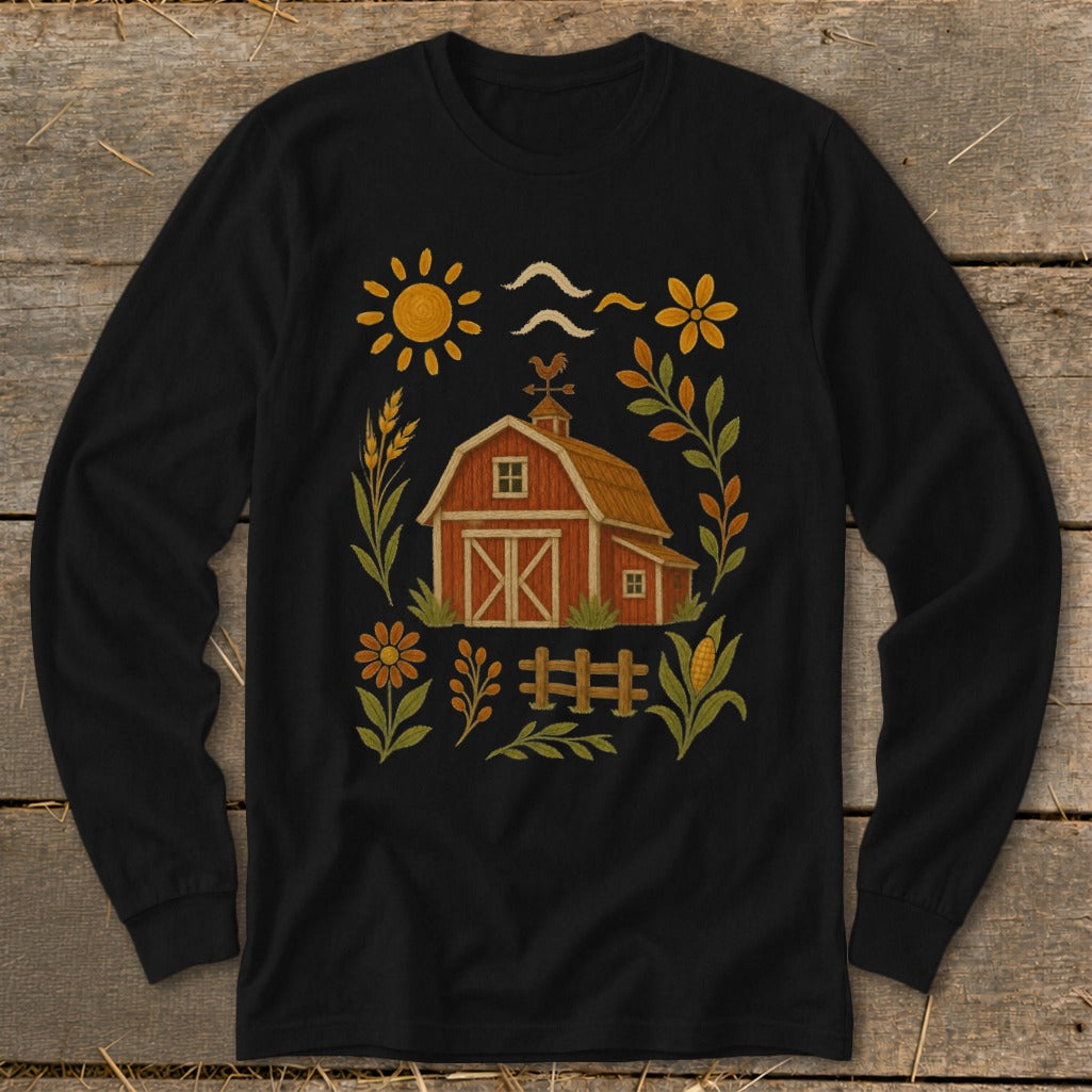 Black long-sleeve shirt with a red barn, sun, flowers, and farm elements graphic.