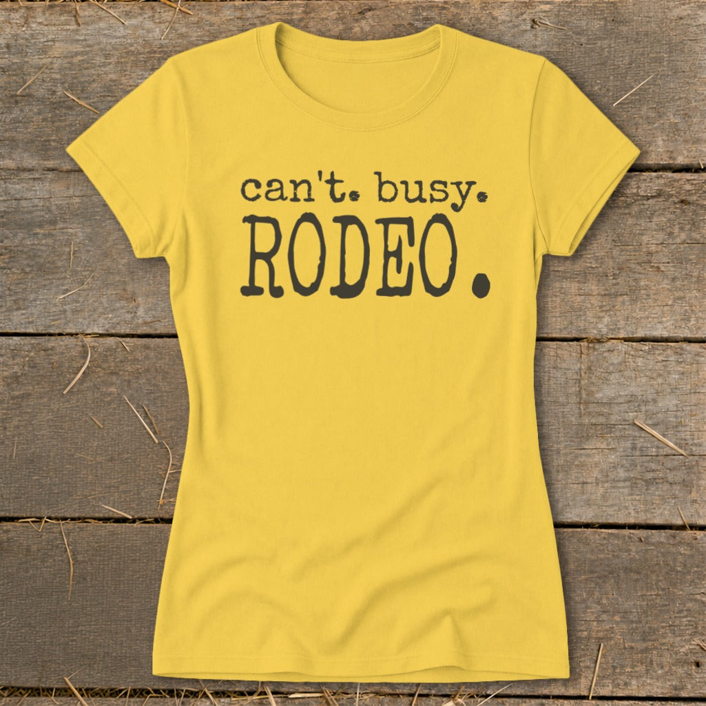 Yellow t-shirt with "can't. busy. RODEO." text in black font.