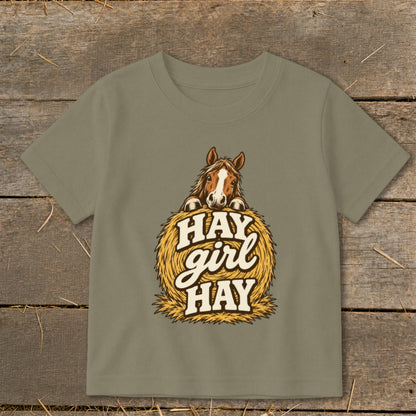 Brown horse peeking over a bale of hay with "Hay girl HAY" text.
