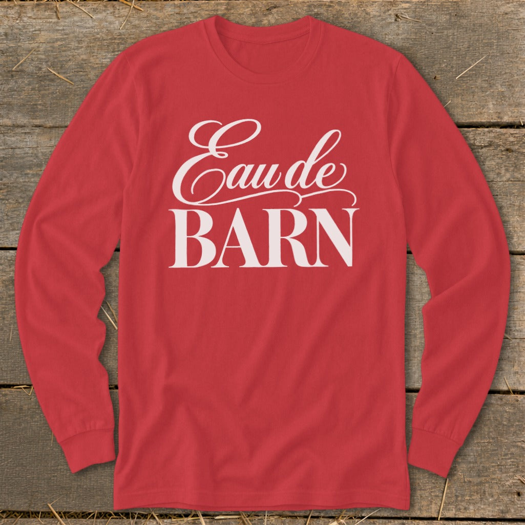 Red long-sleeve shirt with "Eau de BARN" printed in white.