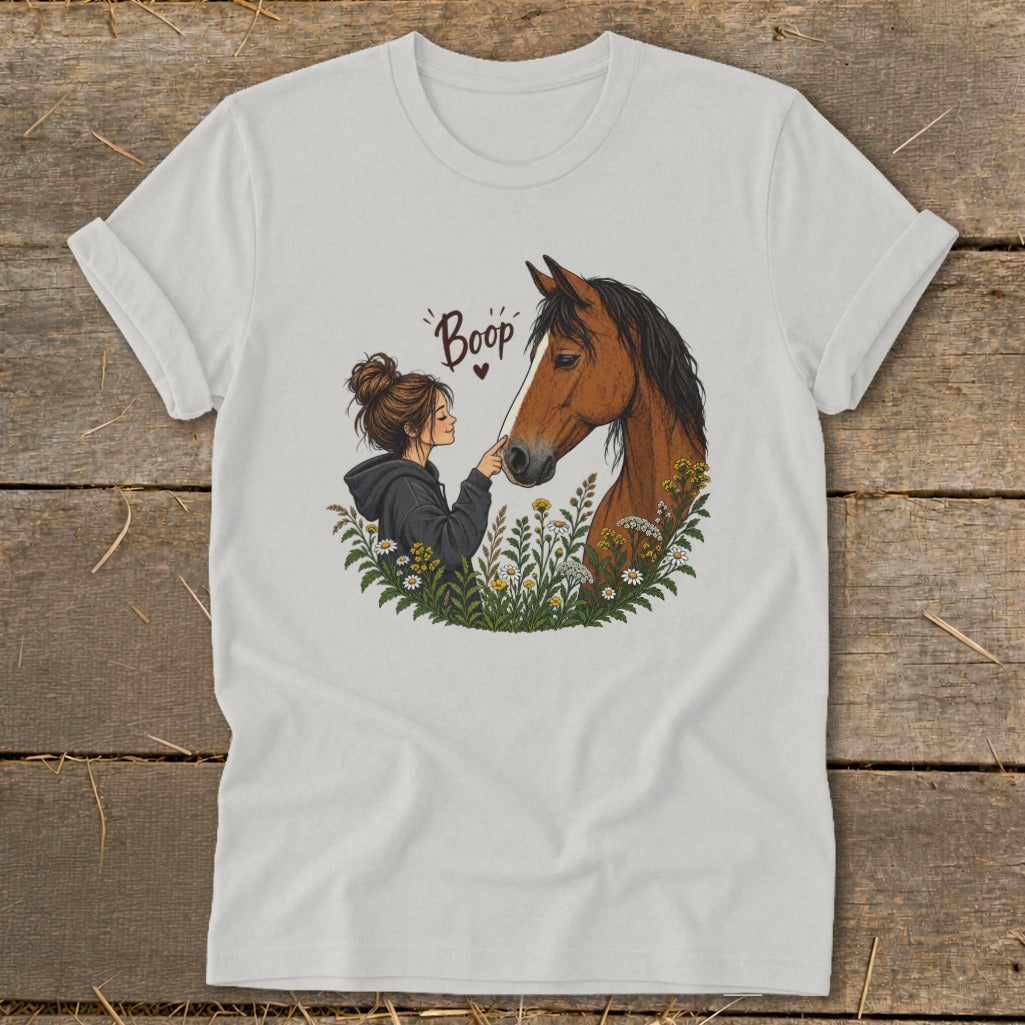 Illustration of a girl gently touching a horse's nose with text "Boop" above.