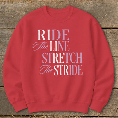 Red sweatshirt with text "RIDE The LINE STRETCH The STRIDE" in varying fonts and colors.