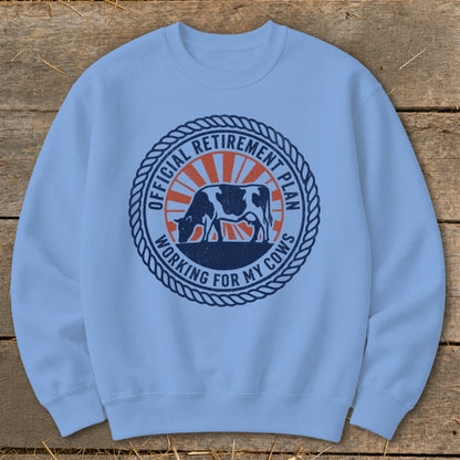 Light blue sweatshirt with "Official Retirement Plan Working For My Cows" graphic.