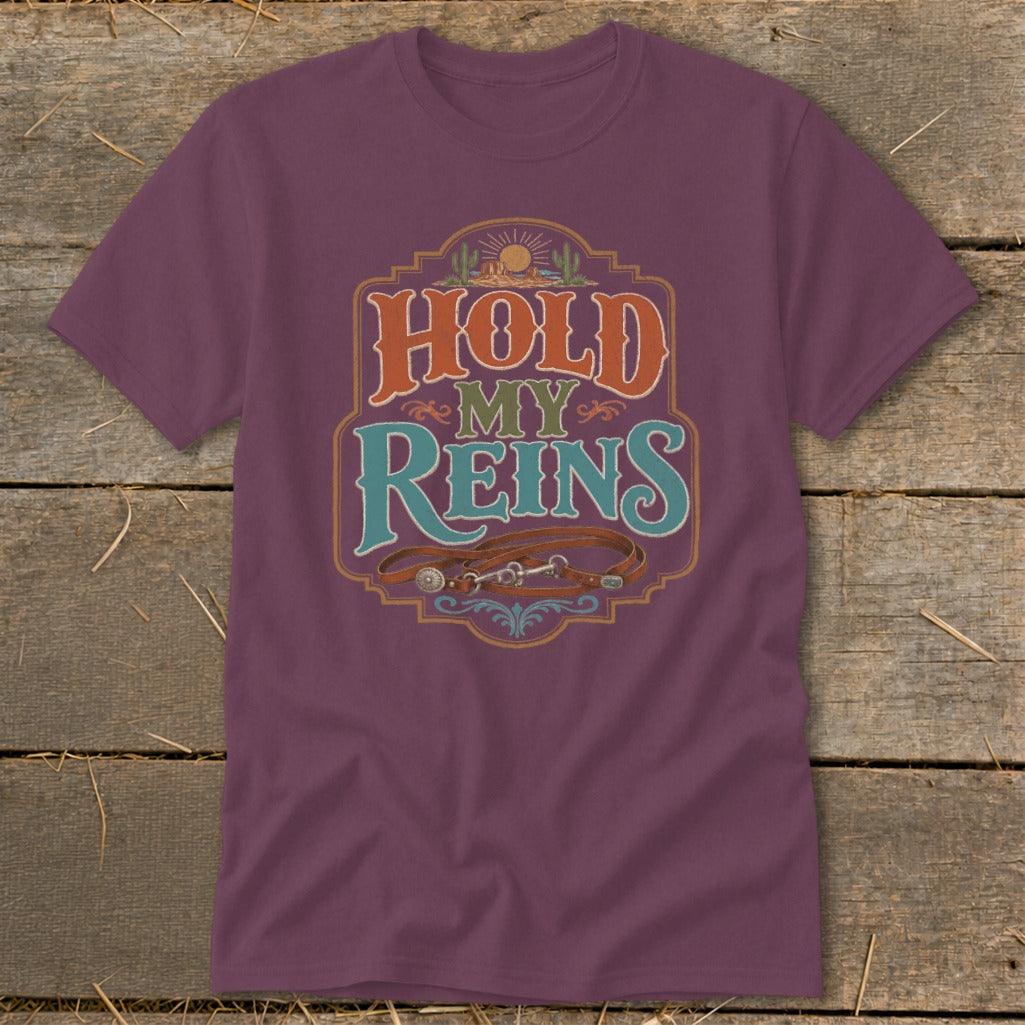 T-shirt with "Hold My Reins" text and leather horse reins graphic.