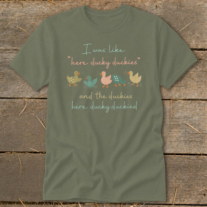Green t-shirt with "I was like 'here ducky duckies'" and duck illustrations.