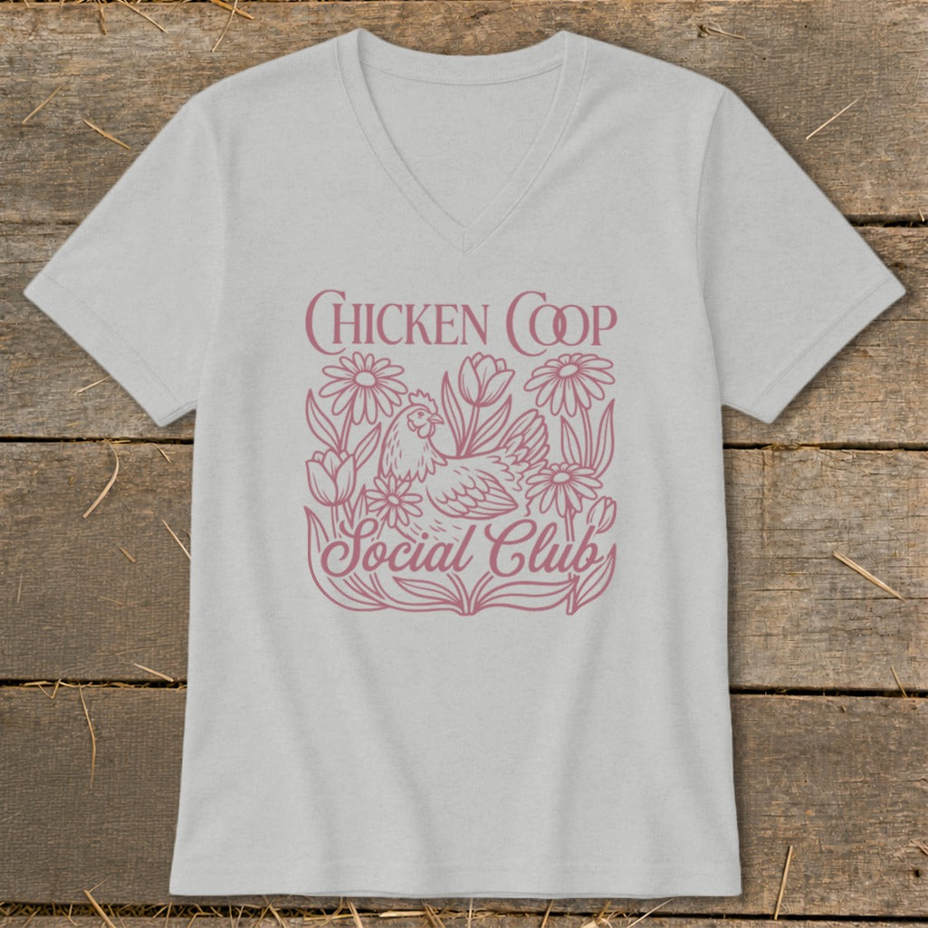 Light gray v-neck t-shirt with pink "Chicken Coop Social Club" text and chicken and flowers graphic.