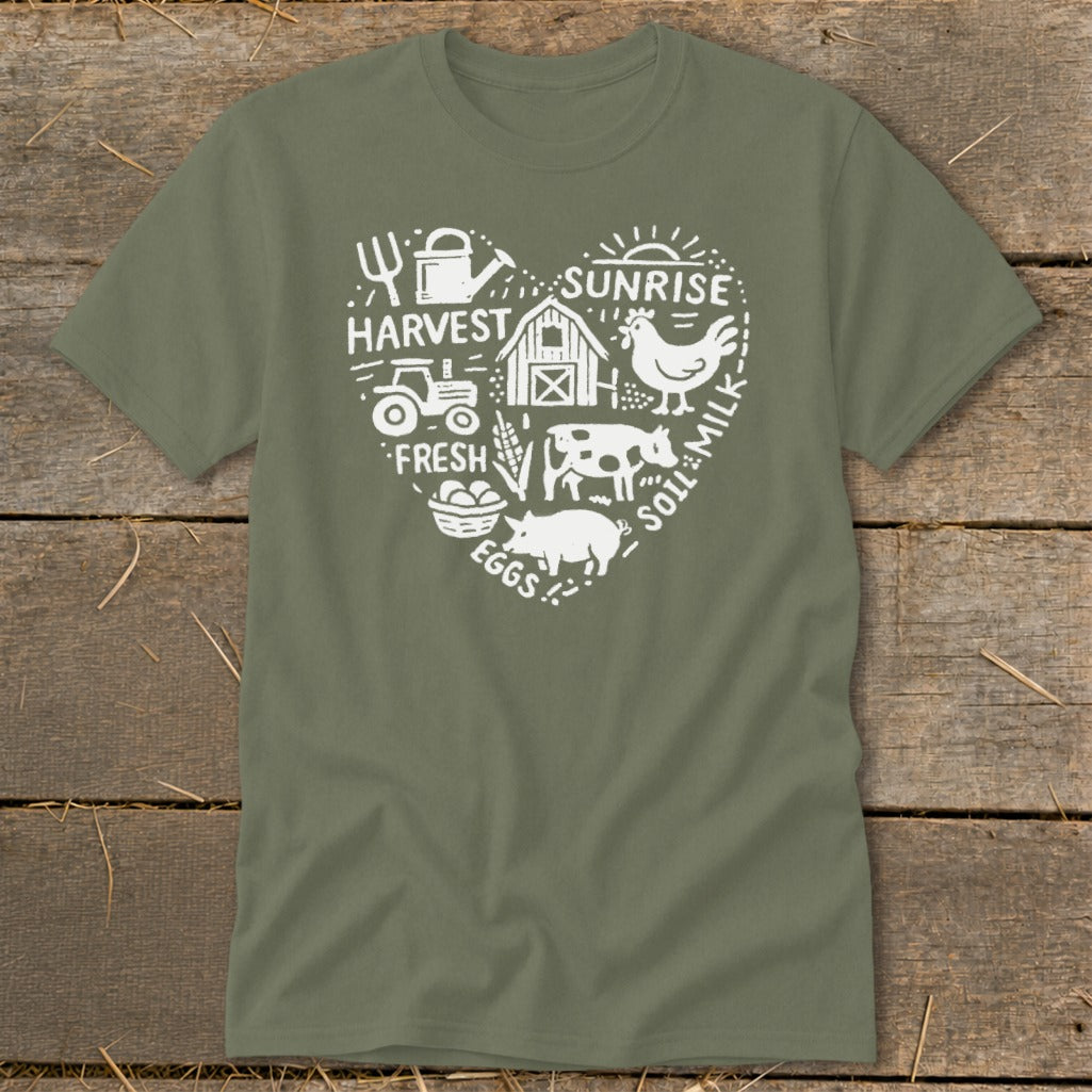 Green t-shirt with white heart graphic featuring farm animals, tractor, barn, and text.