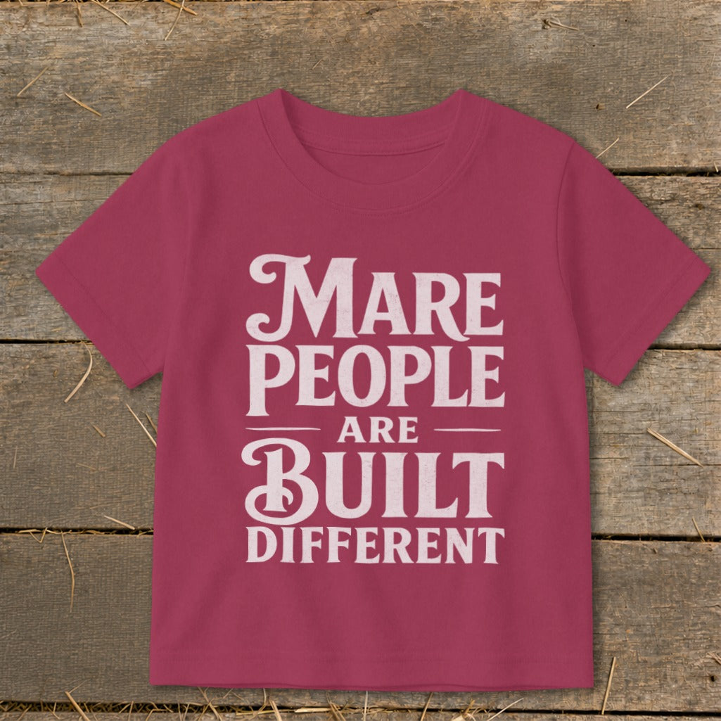 Marbled pink t-shirt with white text reading "Mare People Are Built Different".