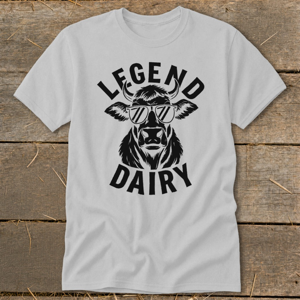 White t-shirt with black graphic of a cow wearing sunglasses and text "LEGEND DAIRY".