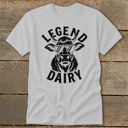 White t-shirt with black graphic of a cow wearing sunglasses and text "LEGEND DAIRY".