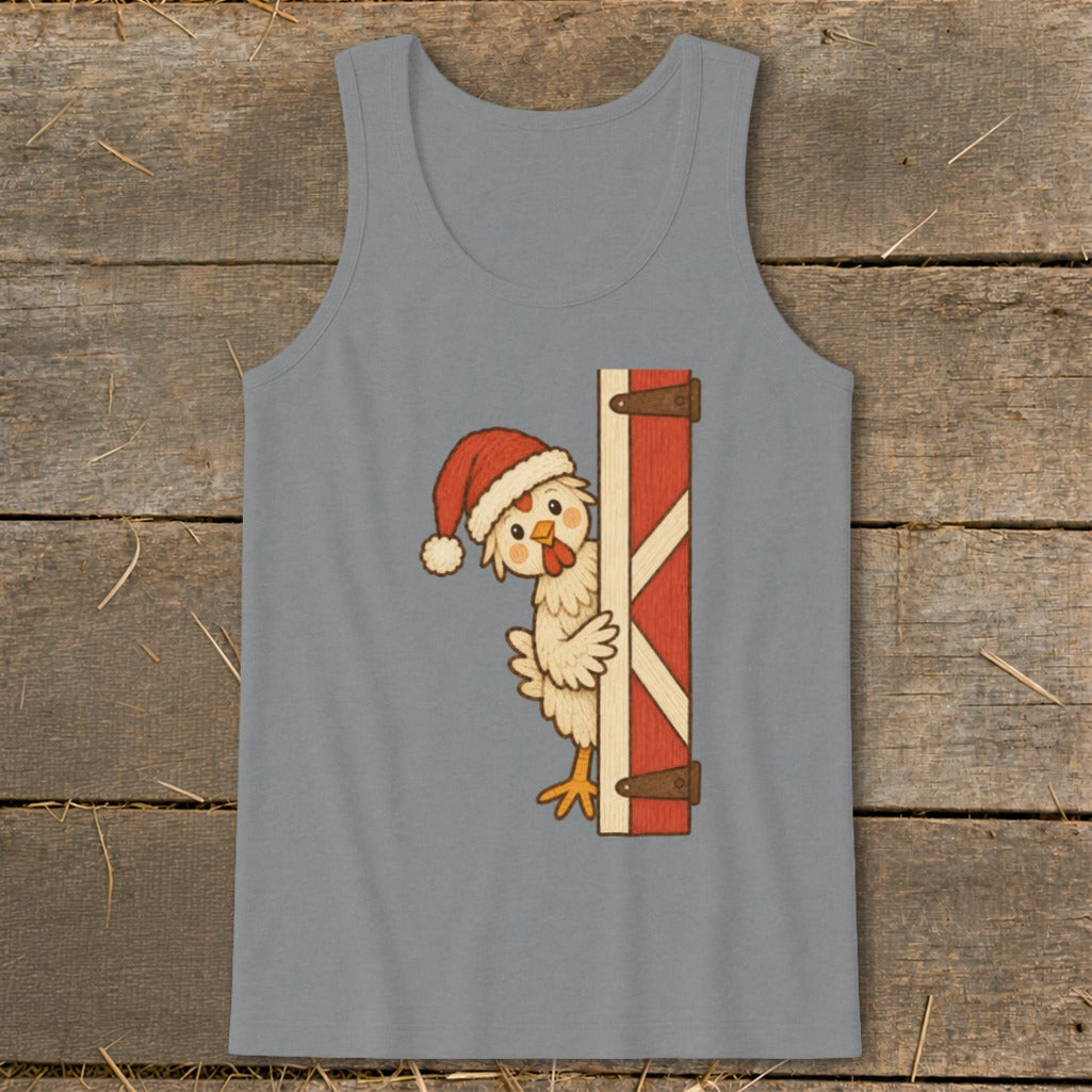 Chicken wearing Santa hat peeking around a red barn door.