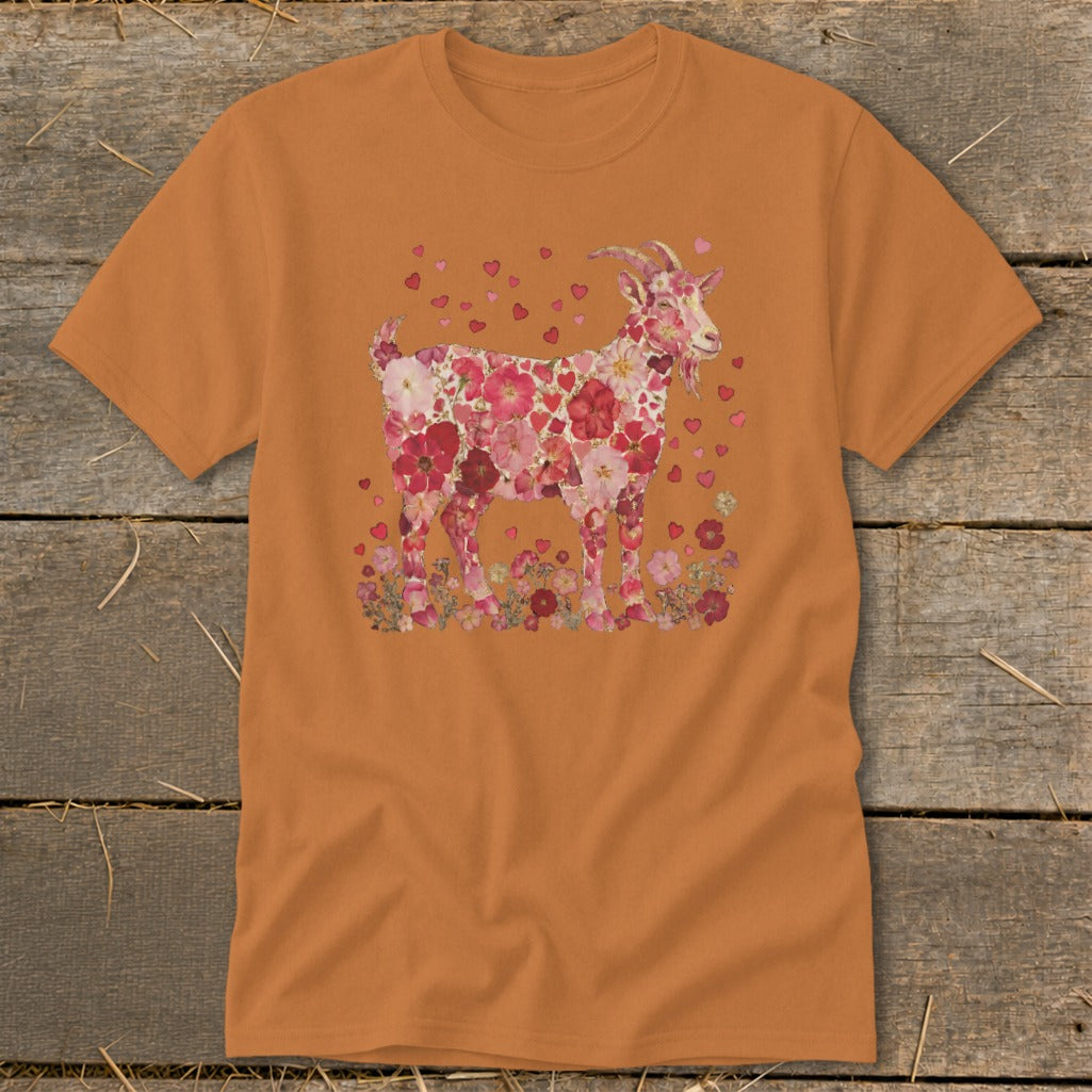 Orange t-shirt with a goat design made of pink and red flowers and hearts.