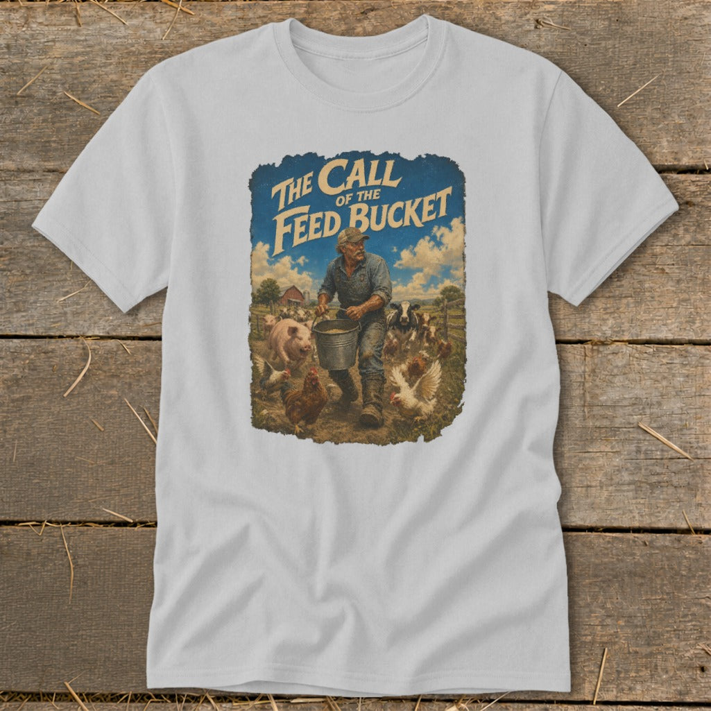 T-shirt graphic with farmer feeding farm animals, text "The Call of the Feed Bucket".