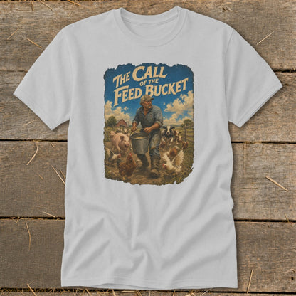 T-shirt graphic with farmer feeding farm animals, text "The Call of the Feed Bucket".