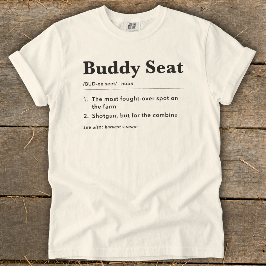 Cream t-shirt with "Buddy Seat" definition, "harvest season" reference.