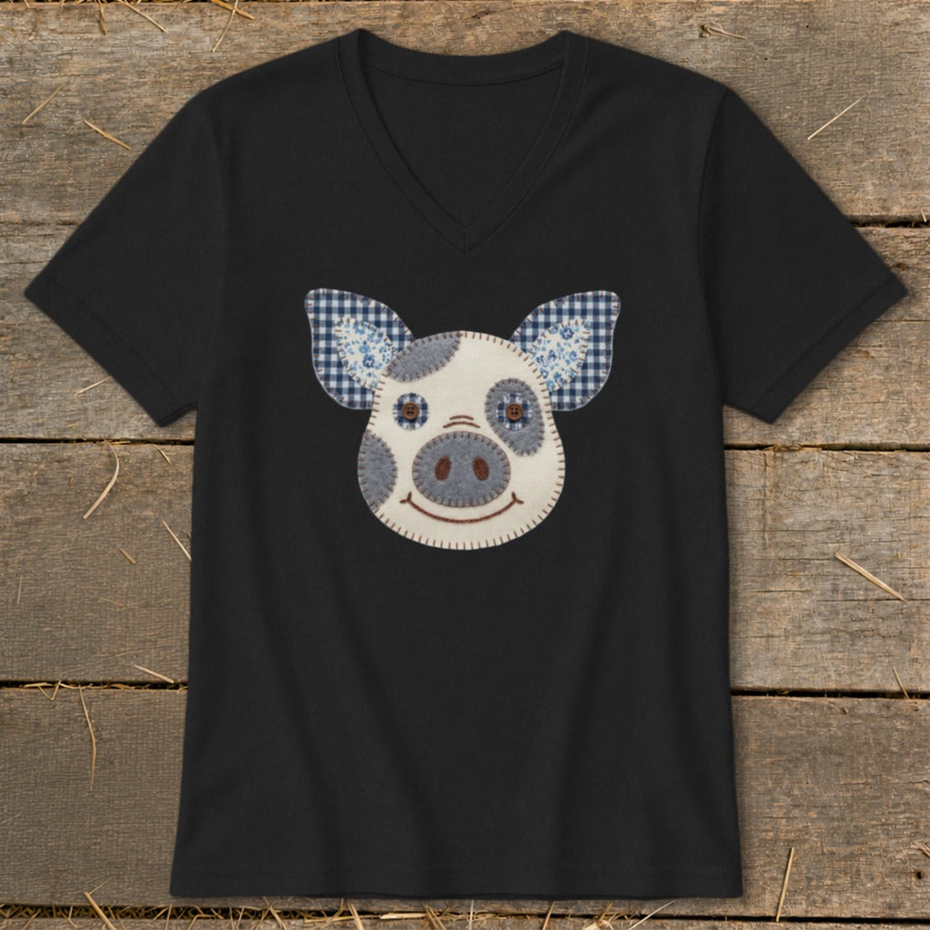 Black v-neck t-shirt with a stitched pig face applique.