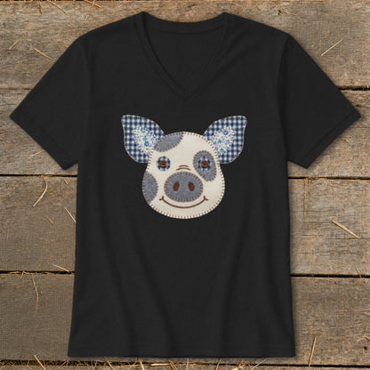 Black v-neck t-shirt with a stitched pig face applique.