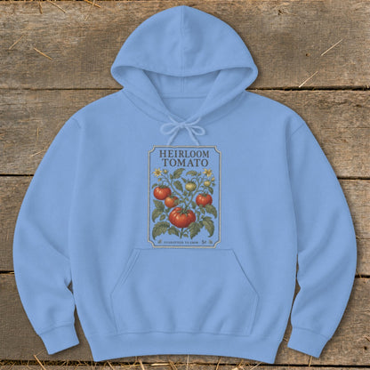 Light blue hoodie with an "Heirloom Tomato" graphic featuring red and green tomatoes and yellow flowers.