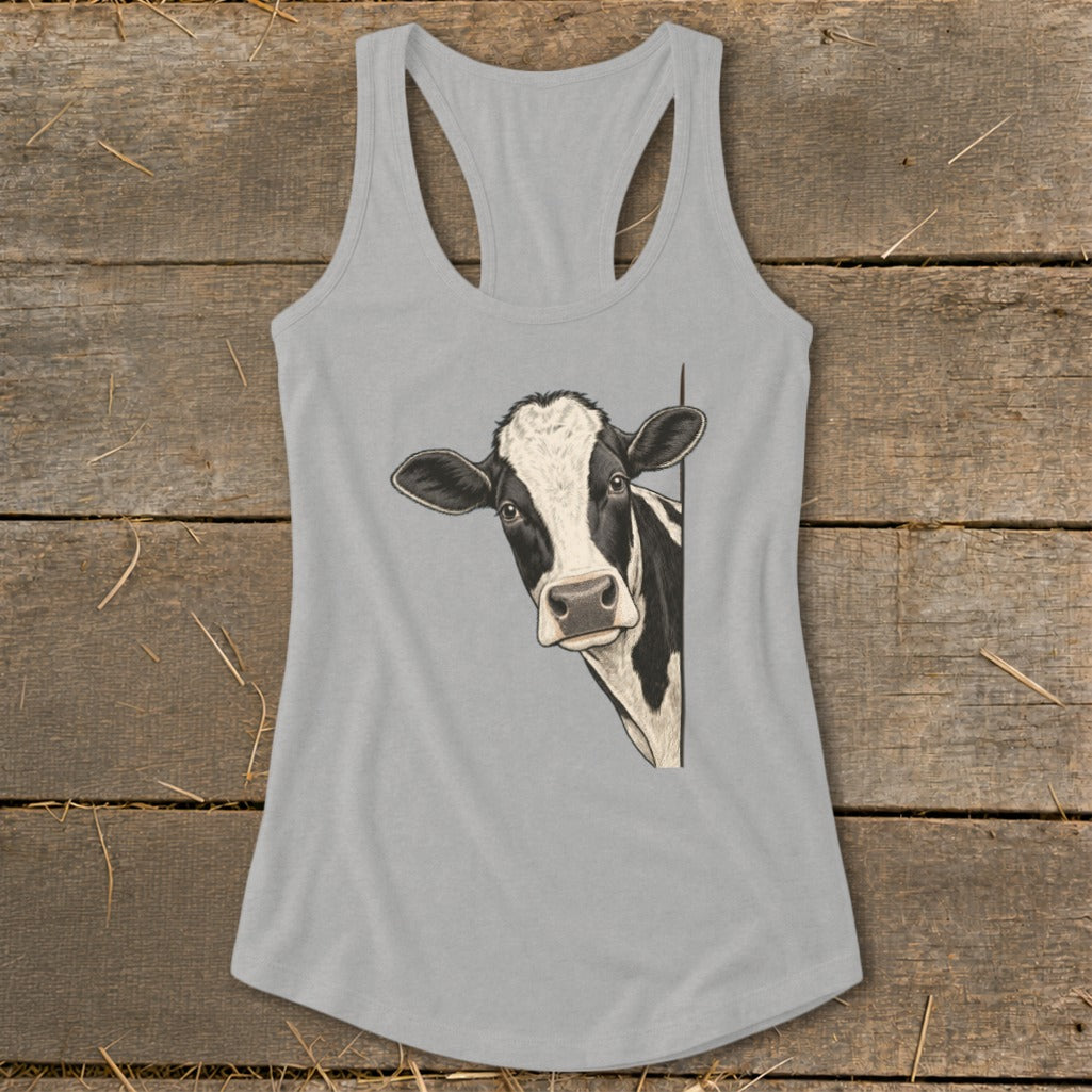 Illustration of a black and white cow peeking from behind on a grey tank top.