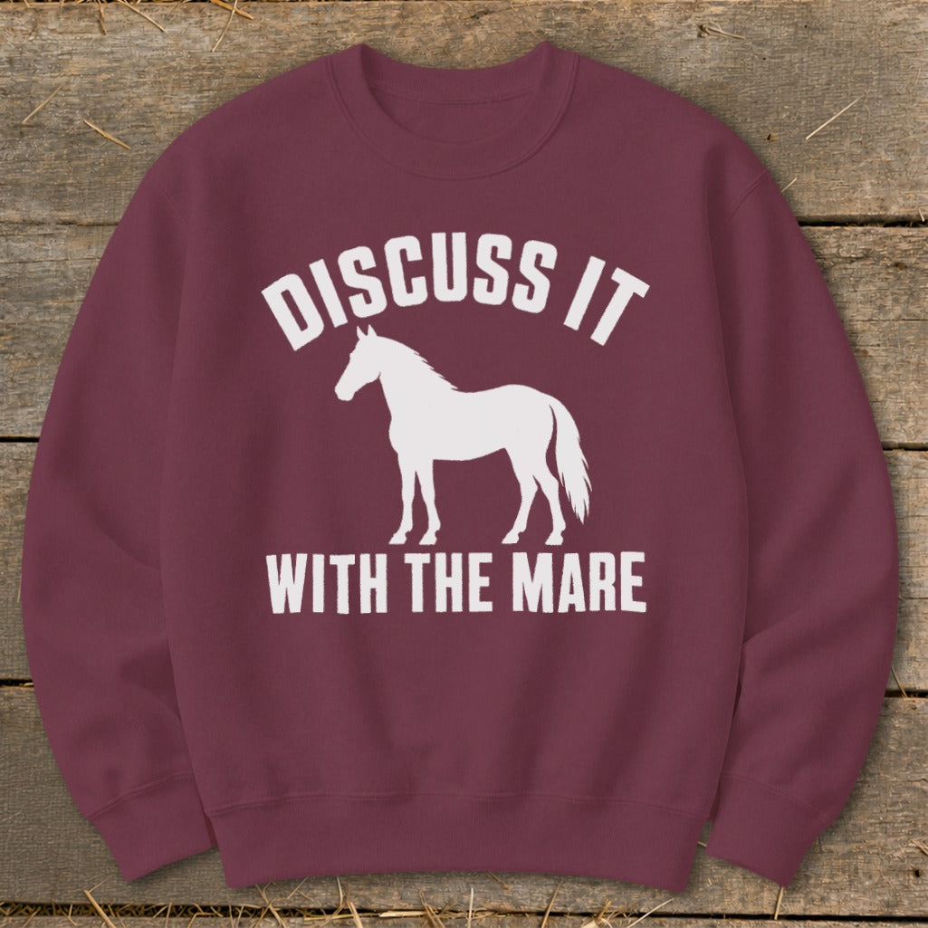 Maroon sweatshirt with white text "DISCUSS IT" and a white horse silhouette.