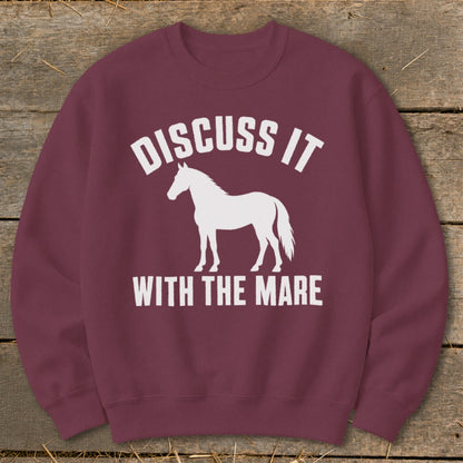 Maroon sweatshirt with white text "DISCUSS IT" and a white horse silhouette.