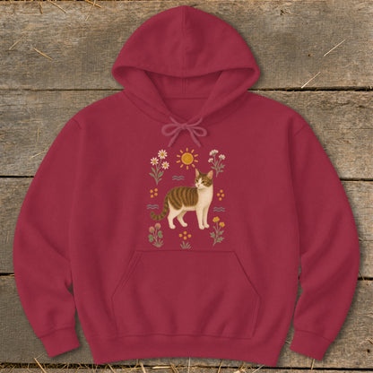 Maroon hoodie with a tabby cat and floral sun illustration.