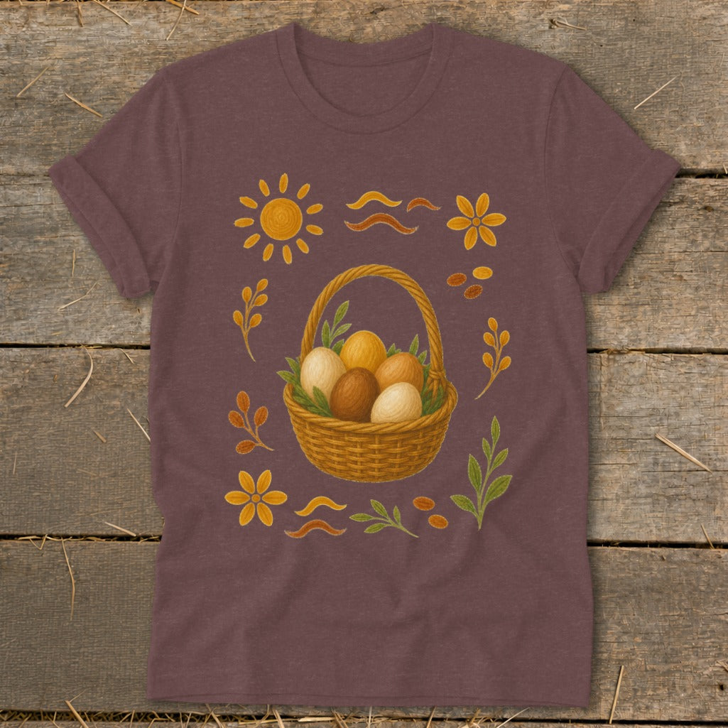 Brown t-shirt with illustration of Easter basket filled with eggs and floral accents.