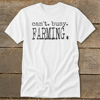 White t-shirt with black text reading "can't. busy. FARMING."