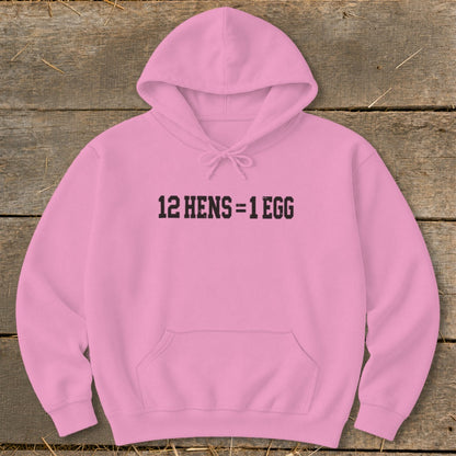 A pink hooded sweatshirt with black text reading "12 HENS = 1 EGG" centered on the chest.