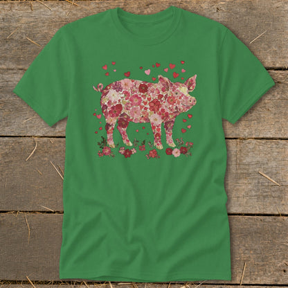 Green t-shirt with a pink floral pig illustration and scattered red hearts.