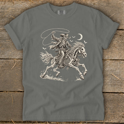 Skeleton cowboy on a skeleton horse with a lasso under a crescent moon.