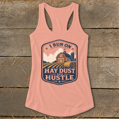 Peach tank top with "I run on hay dust and hustle" farm graphic.